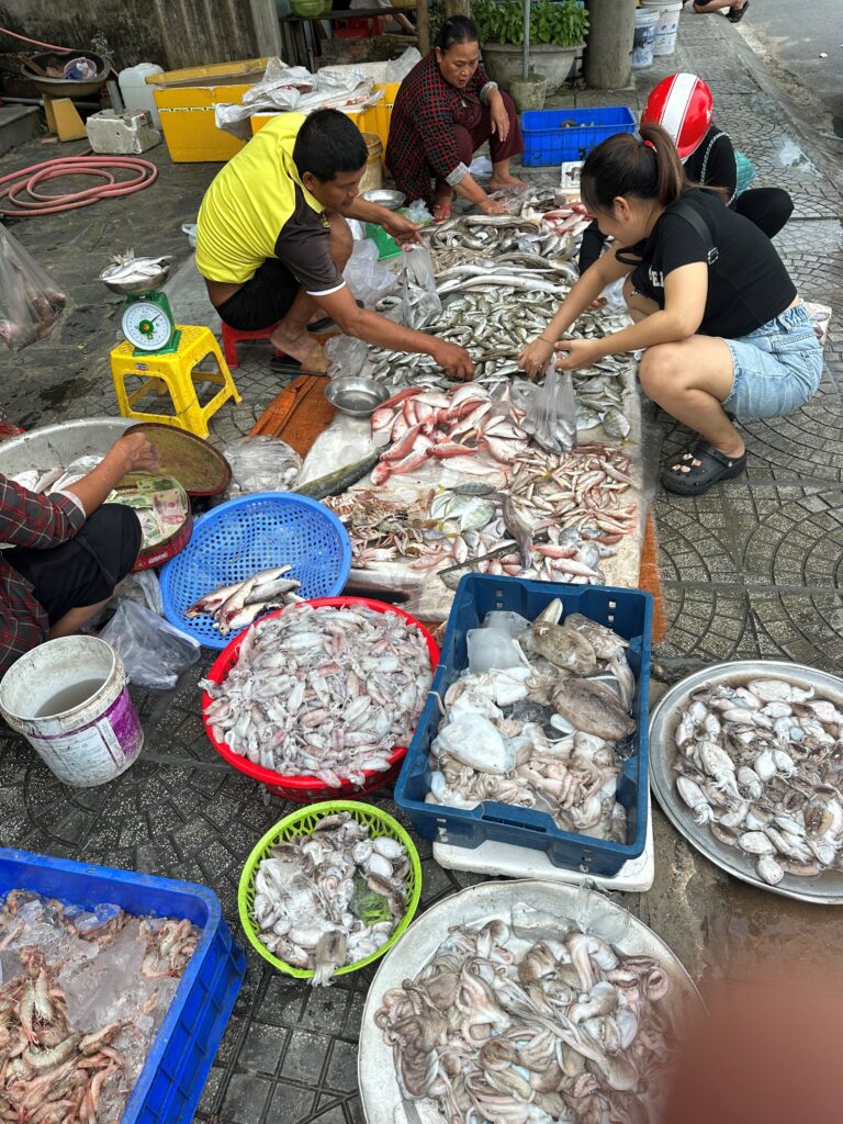 Vietnamese street market showing lots of food